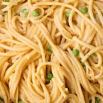 Spaghetti and peas in a creamy sauce.